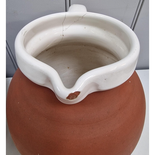 304 - A Royal Barum Ware large terracotta water jug, together with a vintage, two-piece imported wash set.