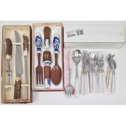 345 - A mixed lot of seven, boxed vintage cutlery sets, an unboxed bone-handled carving set & a trench art... 