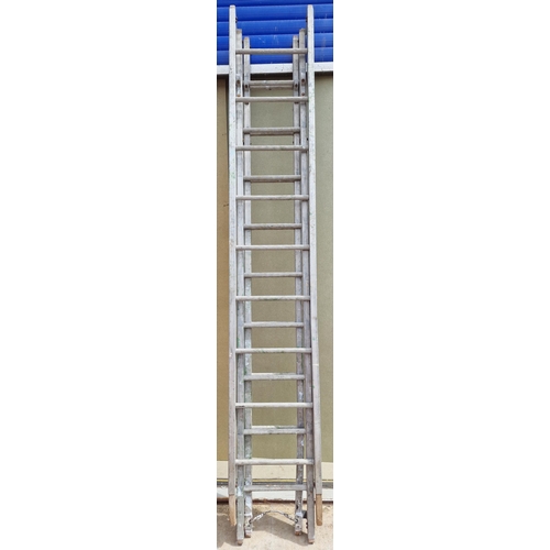 367 - A set of triple aluminium long ladders. Each approximately 8ft in length.