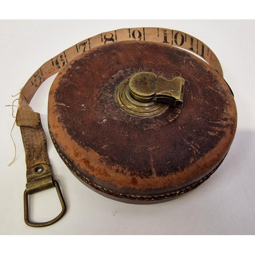 387 - A mixed lot of five vintage items. To include a leather cased, winding tape measure, 'John Bull Mend... 