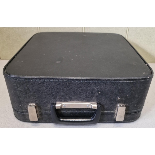 416 - A vintage 'Erika - Robotron 105' portable typewriter with case. Appears in working order.