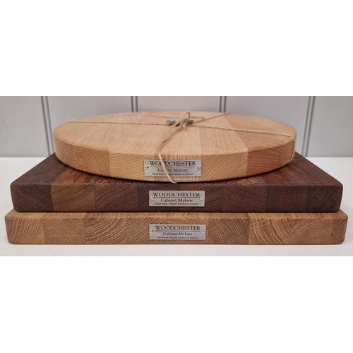 421 - A set of three solid wood chopping boards, made by Woodchester Cabinet Makers. All appear unused.