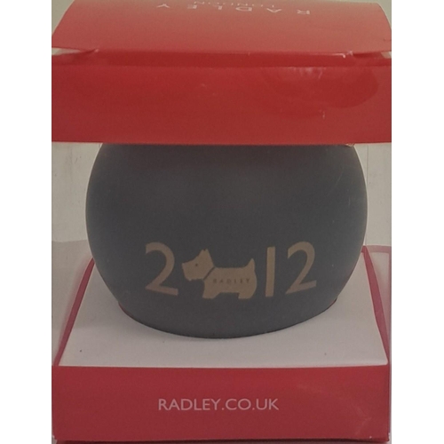 430 - A used 'Radley' brown leather handbag, together with a boxed, limited edition 2012 bauble by the sam... 