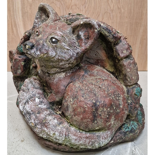 433 - A stone garden fox. Dimensions(cm) H25, W35, D45.