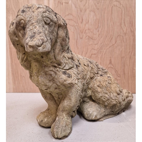 436 - A Spaniel stone garden ornament. Dimensions(cm) H34, L44, W14.