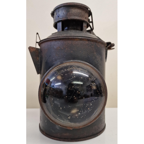 446 - AN early 20th century rail signal lantern. Dimensions(cm) H32, W24, D28.