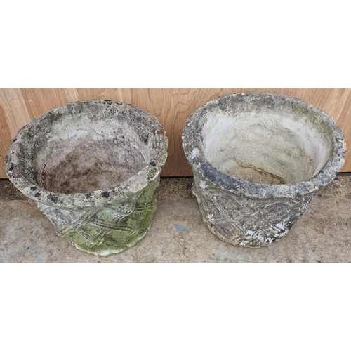 464 - A pair of stone garden planters with lattice design. Dimensions(cm) H24, W32, D32.