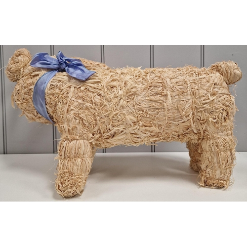 469 - A decorative straw pig. Dimensions(cm) H30, W55, D33/