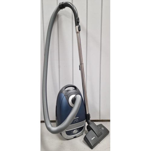 475 - A 'Miele' 2200W cylinder vacuum cleaner, model 'Solution 5281' HEPA, complete with accessories; toge... 