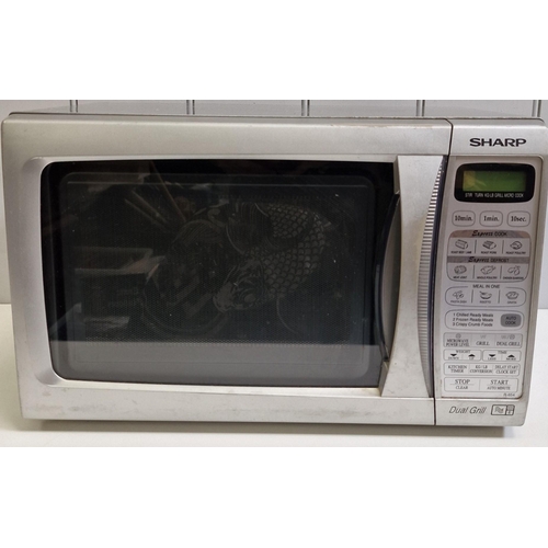 493 - A Sharp 800W Dual Grill/Microwave, model no. R-654(SL)M. PAT test pass & functionality test indicate... 