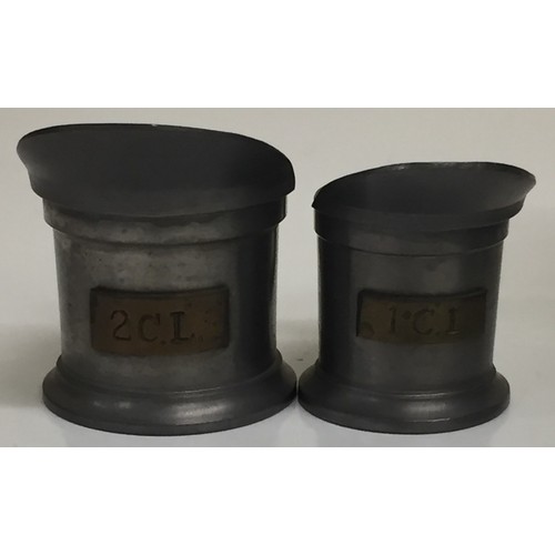 352 - A collection of seven Victorian-era vintage pewter items. To include a lidded sugar pot, spittoon, e... 