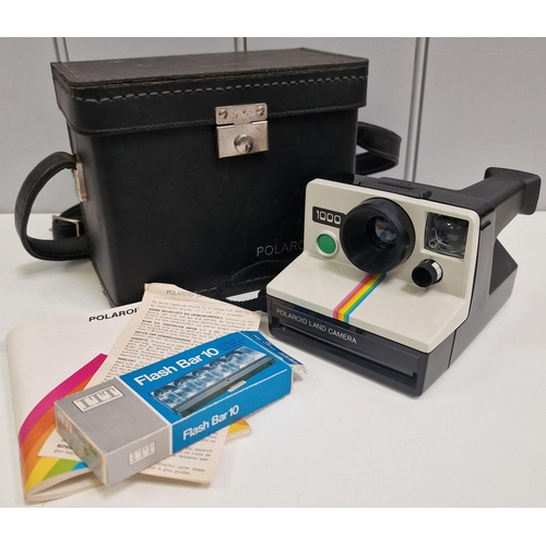 567 - A mixed lot of photography equipment. To include Polaroid SX-70 instamatic camera, Kodak M22 movie c... 