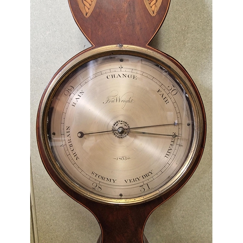 603 - An inlaid mahogany, Georgian wheel barometer. Dial marked 'Frn. Wright' & dated 1805. Appears in wor... 