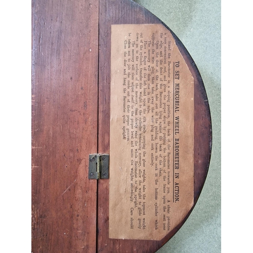 603 - An inlaid mahogany, Georgian wheel barometer. Dial marked 'Frn. Wright' & dated 1805. Appears in wor... 