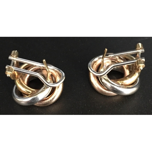 640 - A hallmarked 9ct gold, interlocking hoop design pair of earrings. Weight approx. 7.6g.