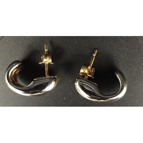 650 - A hallmarked 18ct gold, double-hoop design pair of earrings. Weight approx. 3.2g.