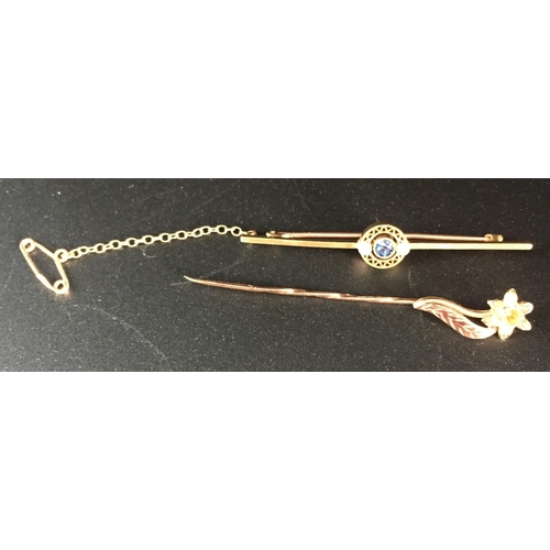 651 - Two pretty, hallmarked 9ct gold brooches. To include a pin flower example & another safety chained w... 