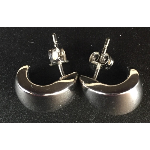 656 - A pair of 18ct white gold semi-hoop earrings (weight approx. 2.5g), together with a pair of 9ct gold... 