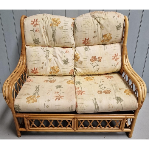 2 - A bamboo & cane conservatory suite, upholstered in a floral patterned beige fabric. To include a two... 