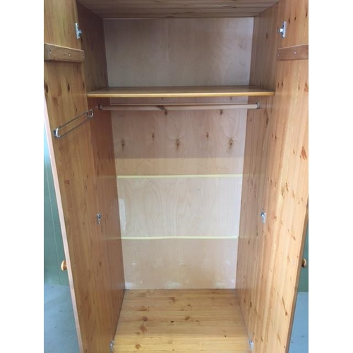 22 - A pine double wardrobe, with single interior shelf & hanging rail. Dimensions(cm) H187, W83, D57.