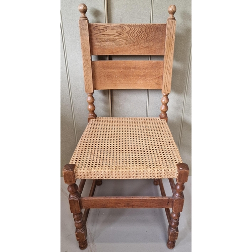 44 - An early 20th century oak hall chair, with woven cane seat. Dimensions(cm) H98(48 to seat), W41, D46... 