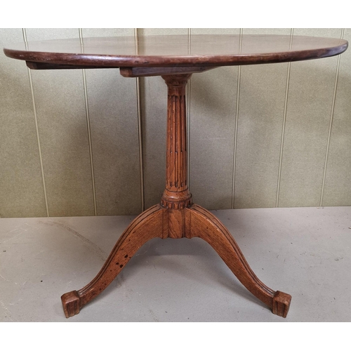 48 - A round, Edwardian pedestal occasional table. Dimensions(cm) H72, W81, D81.