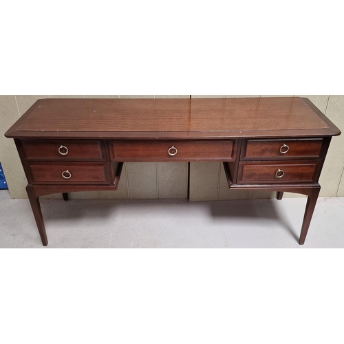 104 - A vintage 'Stag - Minstrel' dressing table, with five drawers. Dimensions(cm) H71, W152, D47.