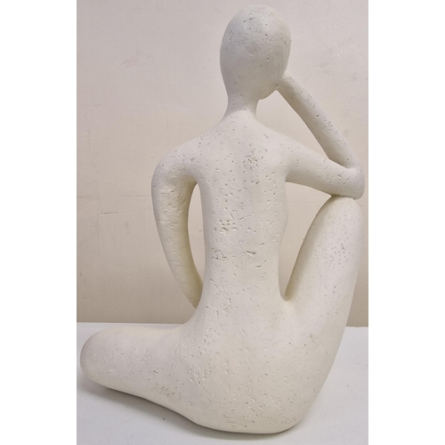 282 - An abstract stone 'Thinker' figurine. Dimensions(cm) H30, W25, D12.