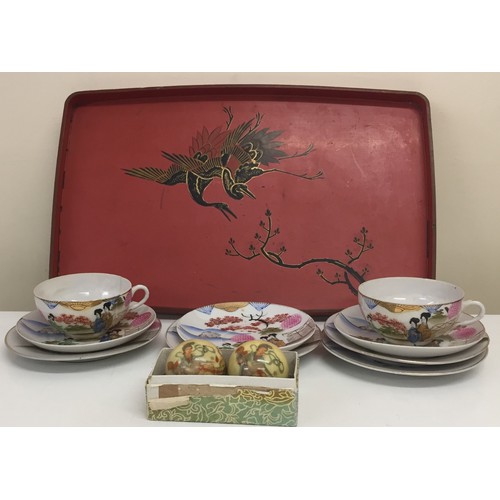 316 - A mixed lot of vintage, oriental pieces. To include a vibrant red Meiji tray, marble health balls & ... 