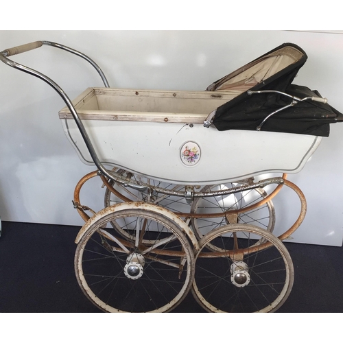 397 - A vintage 'Silver Cross' coach-built pram, with green hood. Dimensions(cm) H96, L120, W63.