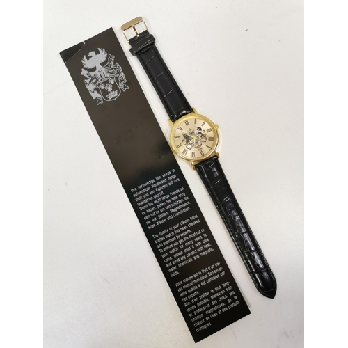 592 - A battery-operated, gold-coloured watch, with a black leather strap, by 'Eiger'. Appears unworn.