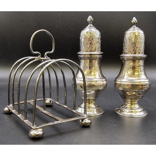 621 - A hallmarked silver toast rack (Chester, by George Nathan & Ridley Hayes), together with a hallmarke... 