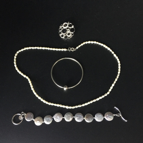 653 - A mixed collection of sterling silver & costume jewellery. To include a 'Pandora' bangle, silver bro... 