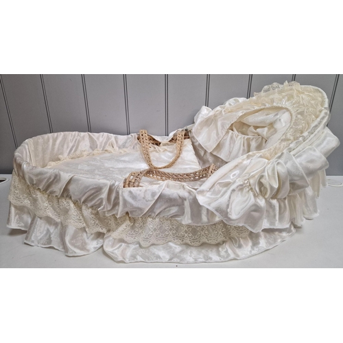 741 - A vintage doll & bassinet.