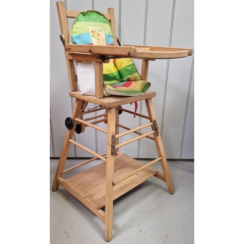 743 - A beech, doll's highchair. Dimensions(cm) H98, W51, D51.