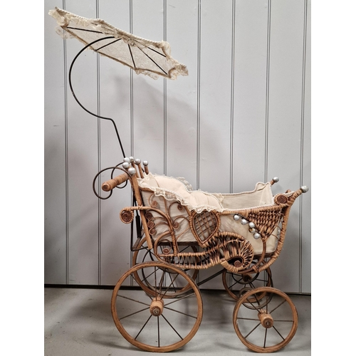 745 - A vintage, Victorian-style wicker & iron doll's pram, with parasol. Overall dimensions with parasol(... 