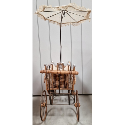 745 - A vintage, Victorian-style wicker & iron doll's pram, with parasol. Overall dimensions with parasol(... 