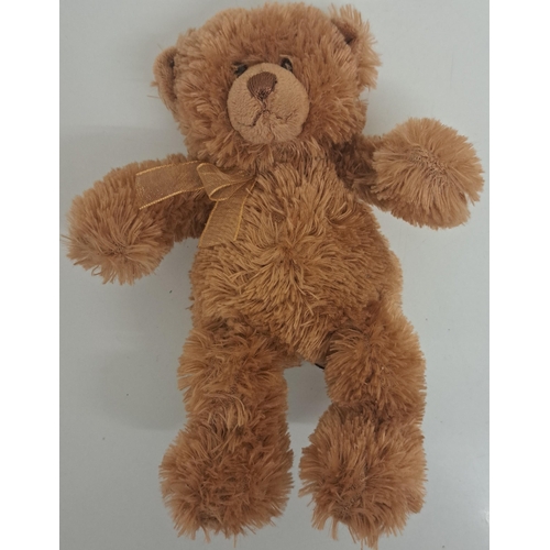 764 - A mixed lot of three collectible items. To include a 'Gund' teddy bear (height 15cm), 'Russ' dog (le... 