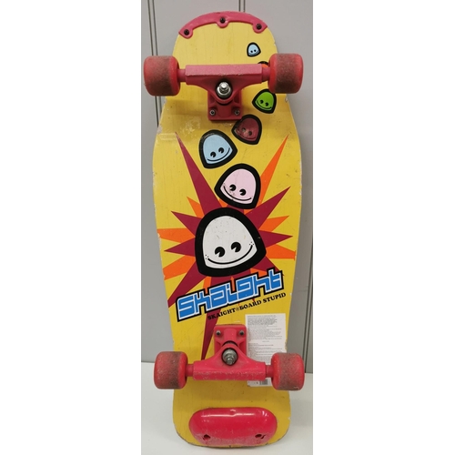 789 - A colourful 1980's skateboard, by 'Skaight Board Stupid'. Length 77cm, width 26cm.