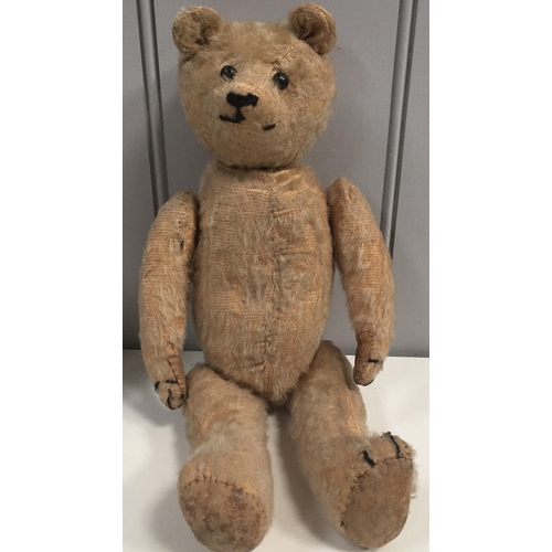 799 - An early 1900's teddy bear. Button eyes, stitched/elongated snout, long limbs, straw-filled. Height ... 