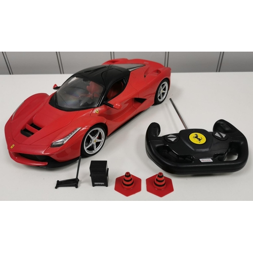 800 - An unboxed, 'Rastar' radio-controlled Ferrari & accessories. Untested.