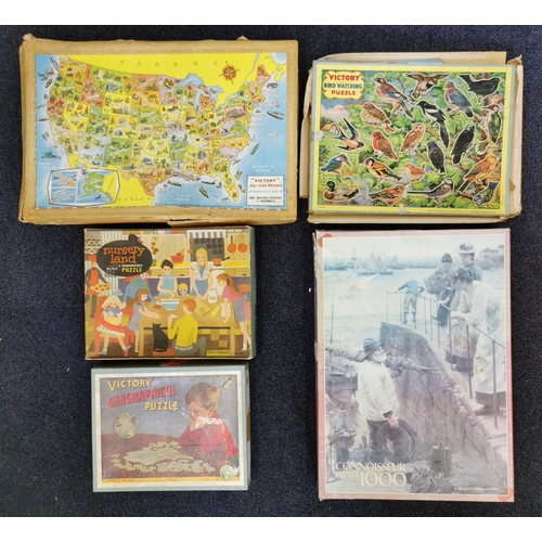 801 - A collection of five, vintage boxed puzzles. To include three 'Victory' examples. Unchecked for comp... 