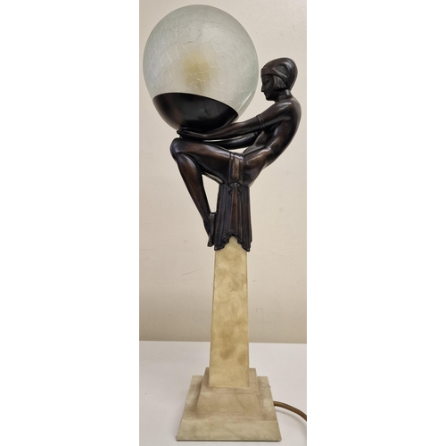 5044 - An art-deco lamp, in the manner of Max Le Verrier, featuring a seated female figure in a seated posi... 