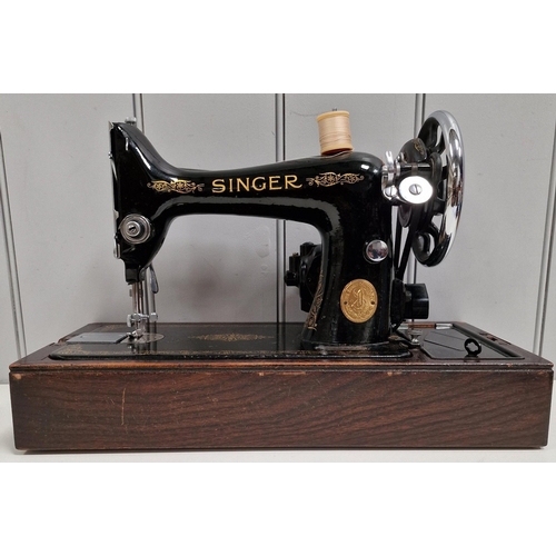 5063 - A 1944 Singer sewing machine, with case. Dates to 1944, with Singer electrification unit. Will requi... 