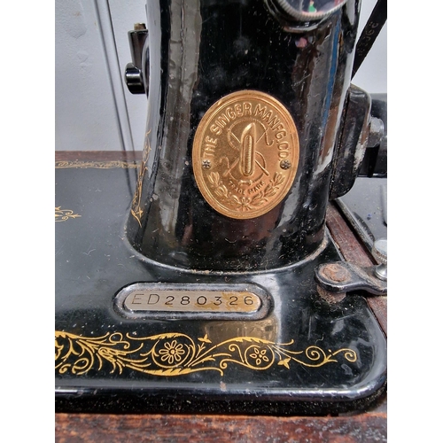 5063 - A 1944 Singer sewing machine, with case. Dates to 1944, with Singer electrification unit. Will requi... 