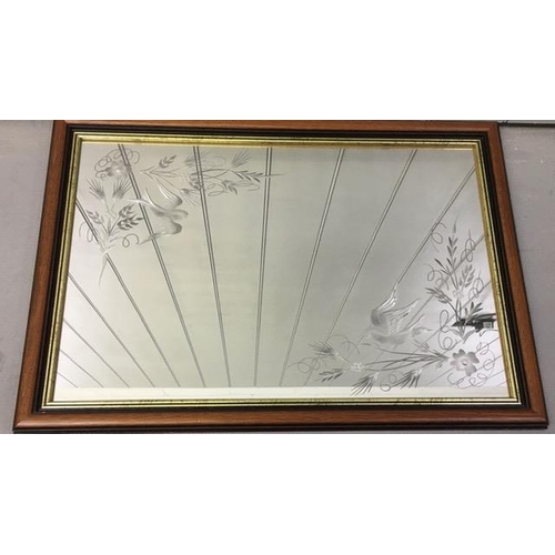 6207 - A bevelled-edged mirror, with etched bird & floral designs to top & bottom. Dimensions(cm) H60, W85.