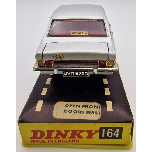 3820 - An original, boxed, late 1960's, Dinky Ford Zodiac MkIV, in silver. Model no. 164.