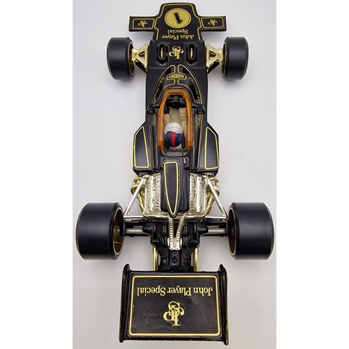 3821 - A boxed, 1:18 scale, original Corgi Lotus John Player Special Formula 1 car. Complete with instructi... 