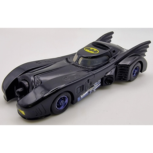 3825 - A carded, 1:43 scale Ertl Batmobile. Model no.2575. Card blister has been opened.