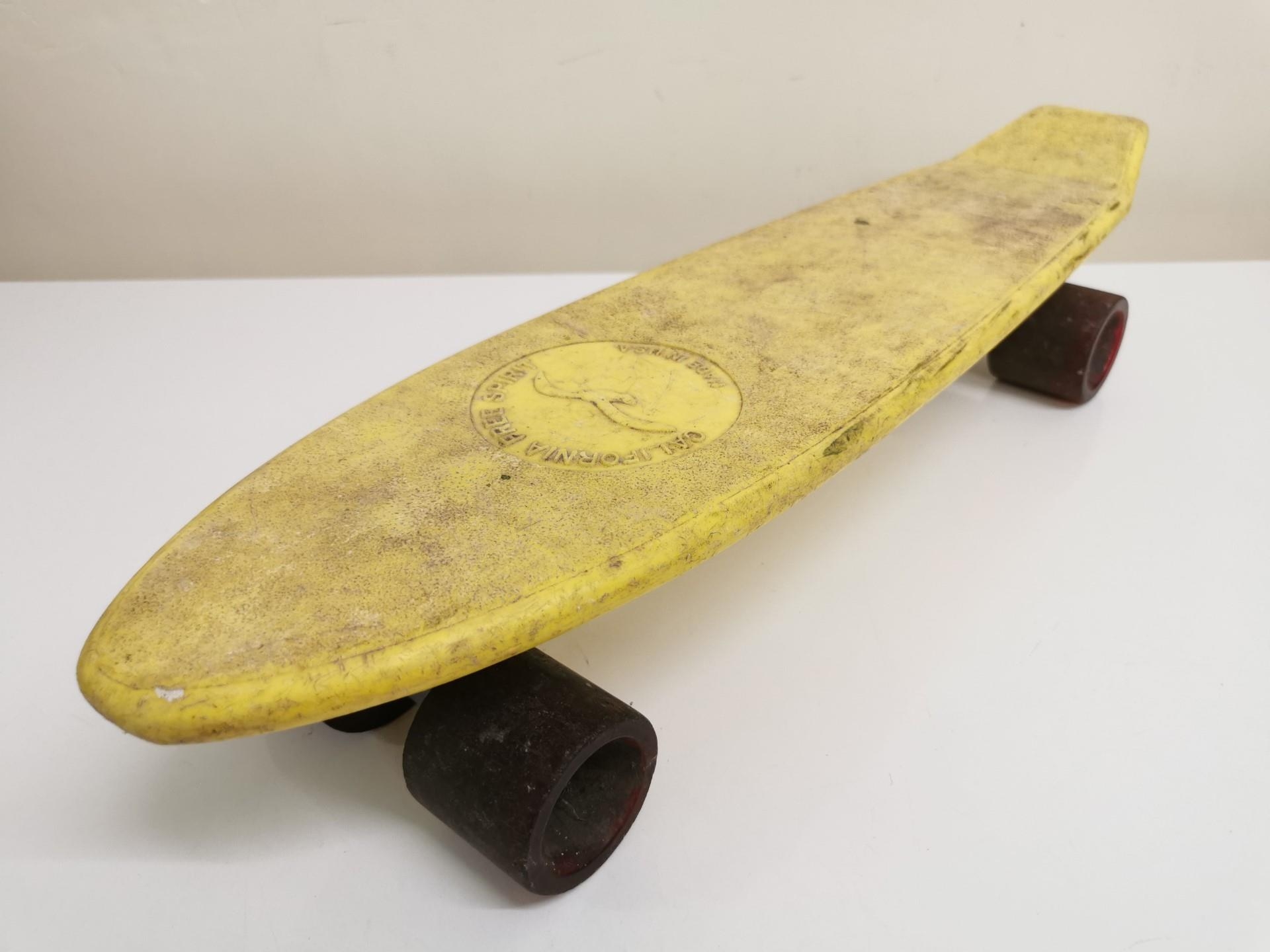 A vintage 1970's, yellow 'California Spirit' 'Pennyboard